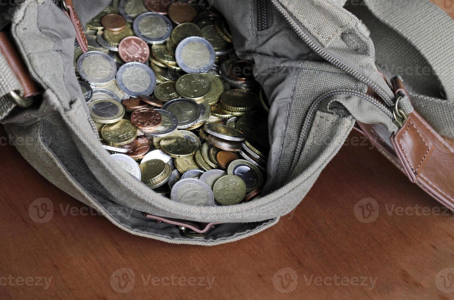 A messenger bag filled with cash photo