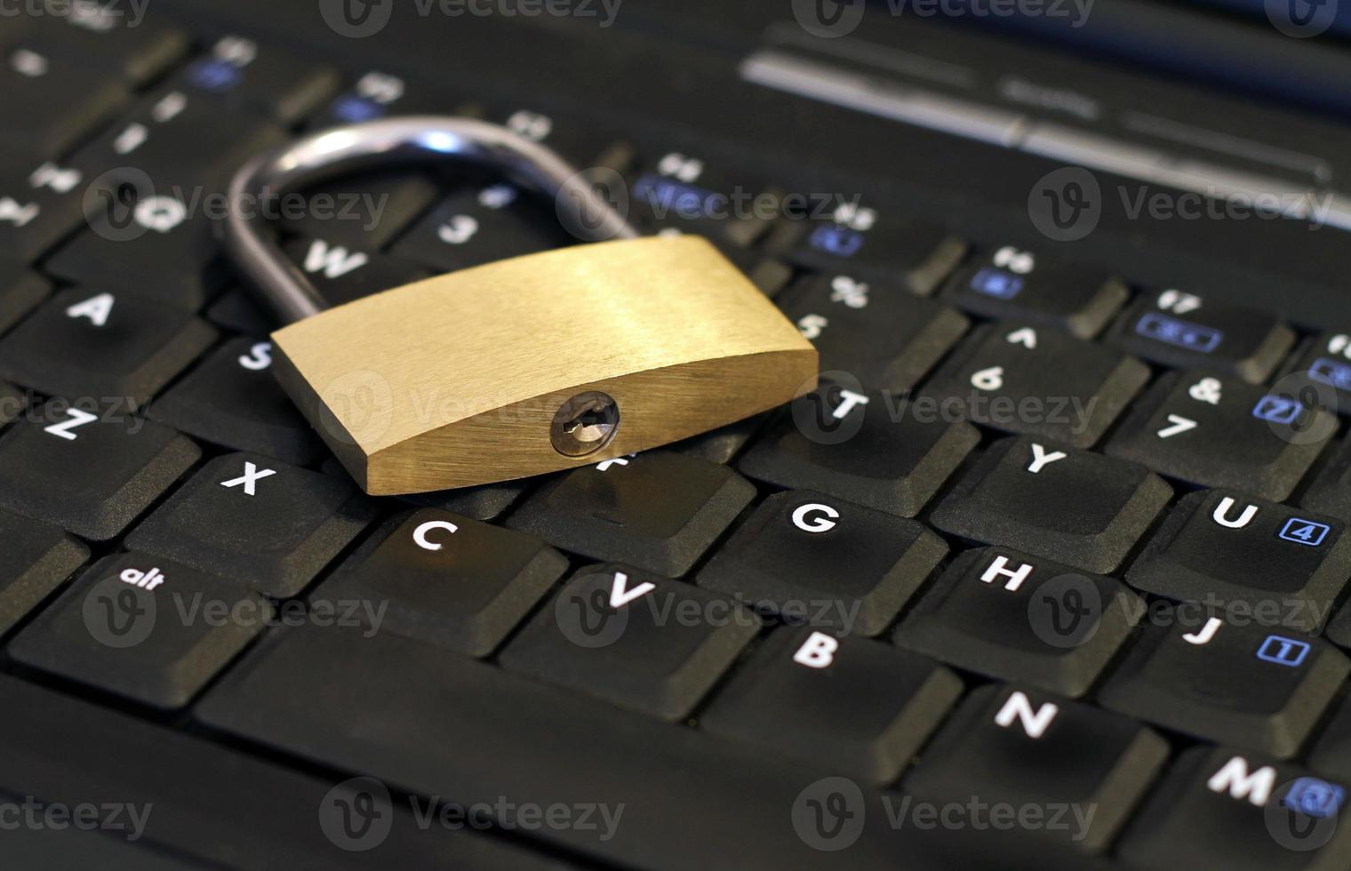 IT security and encryption - padlock on laptop photo