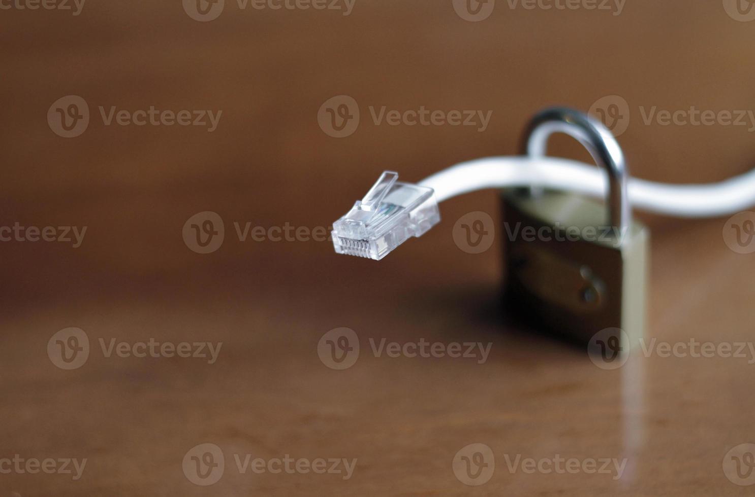 Network protection and secure access - network cable going through a padlock photo