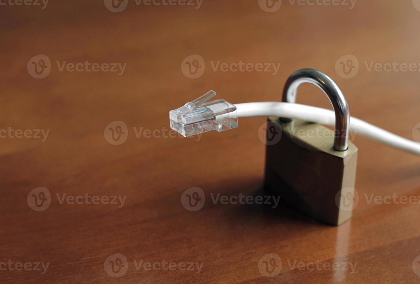 Network protection and secure access - network cable going through a padlock photo