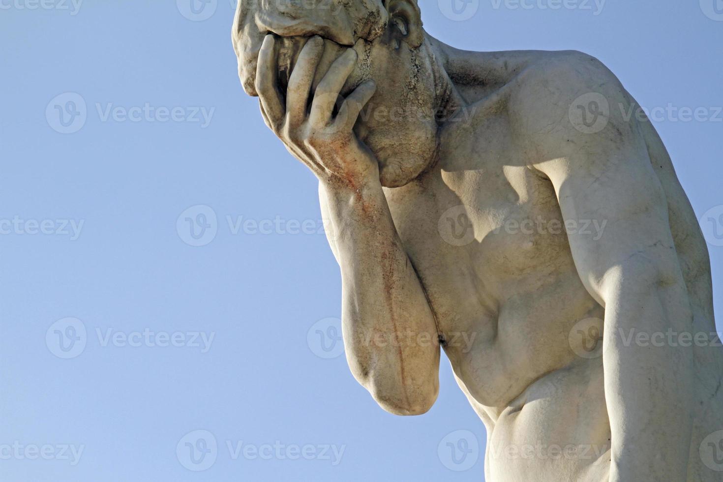 Head in hands - Statue in Paris, France photo