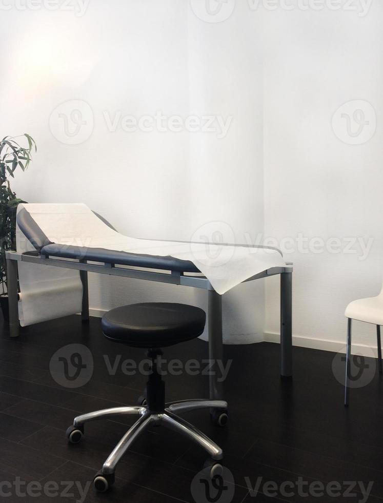 Bench and stool in doctor's office photo