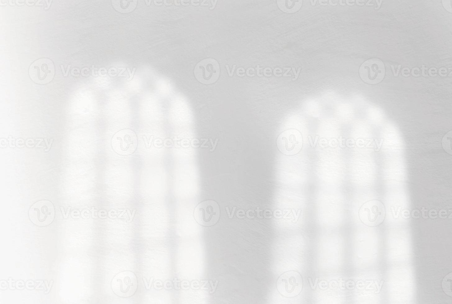 Window shadow overlay on white concrete wall photo