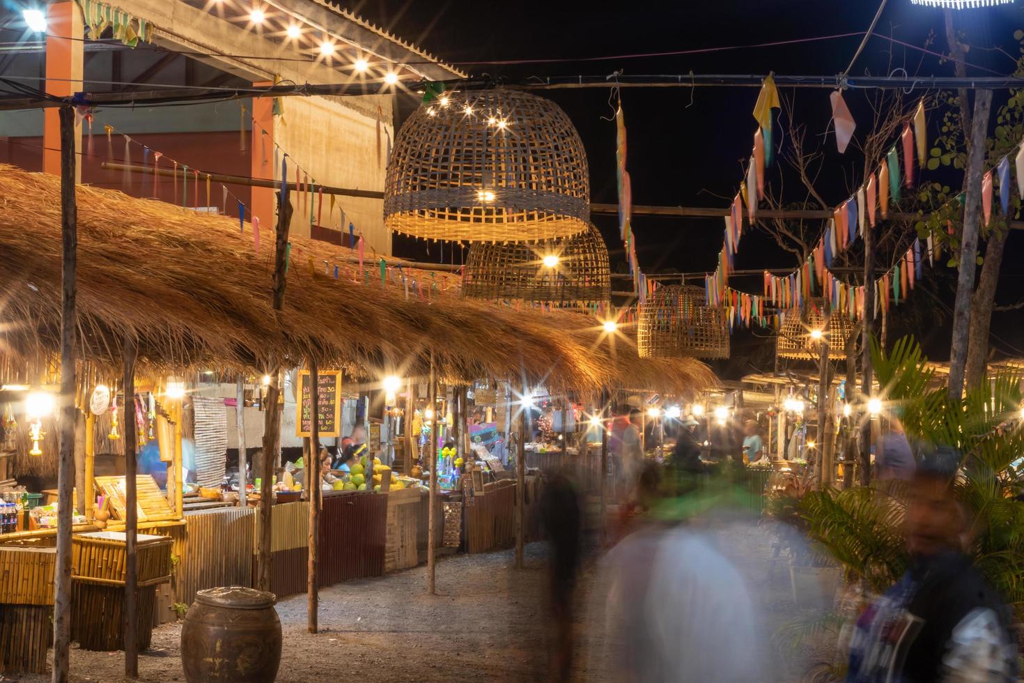 Lighting from chicken coop hung over the night market. photo