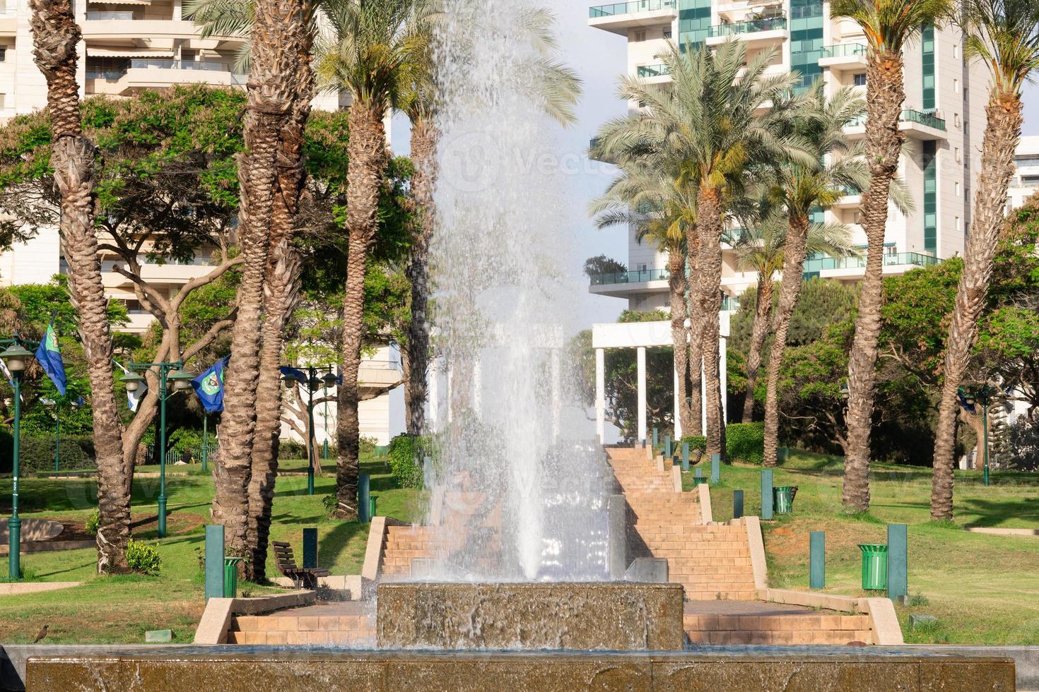 Beatiful park with a fountain in Ramat Gan town in Israel photo