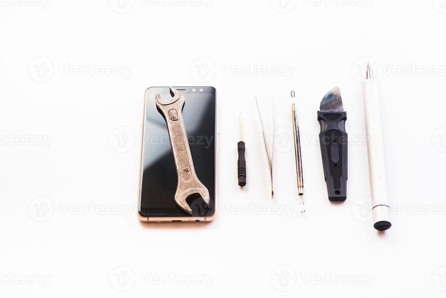 Flat lay image of dismantling the broken smart phone for preparing to repair or replace some components. isolated photo