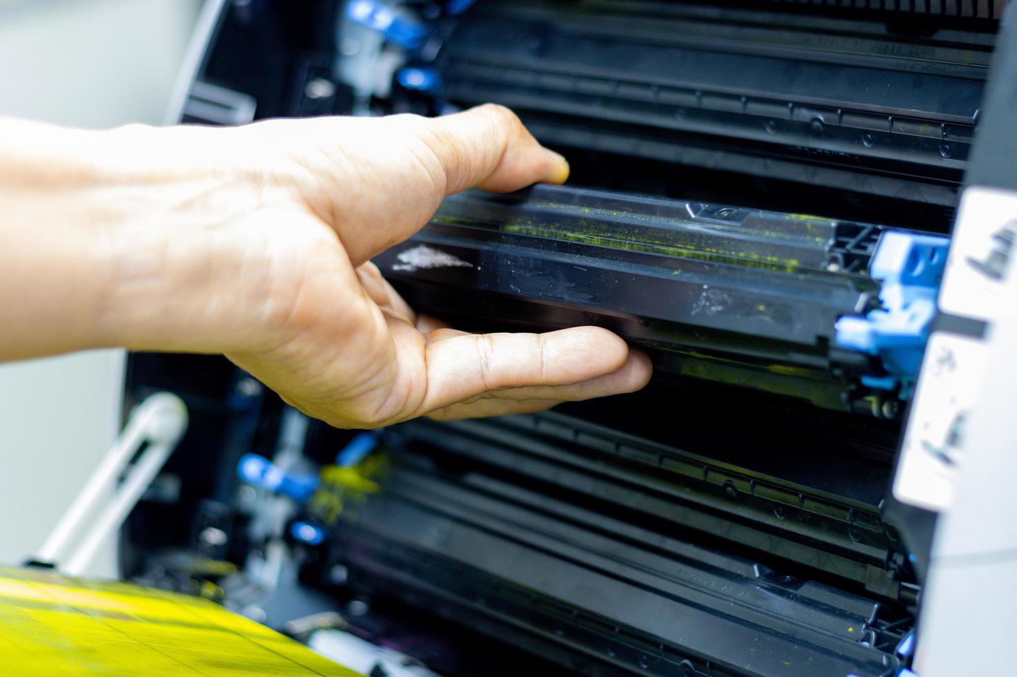 Technicians replacing toner in laser printer concept office supplies repair photo