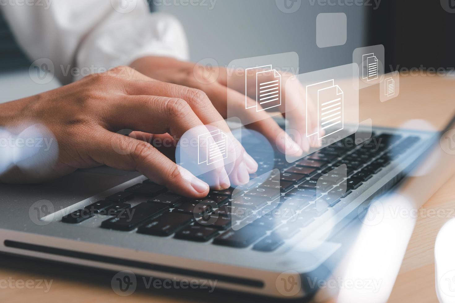 Business woman hand using laptop computer with document management icon, Document management data system business internet technology concept. photo