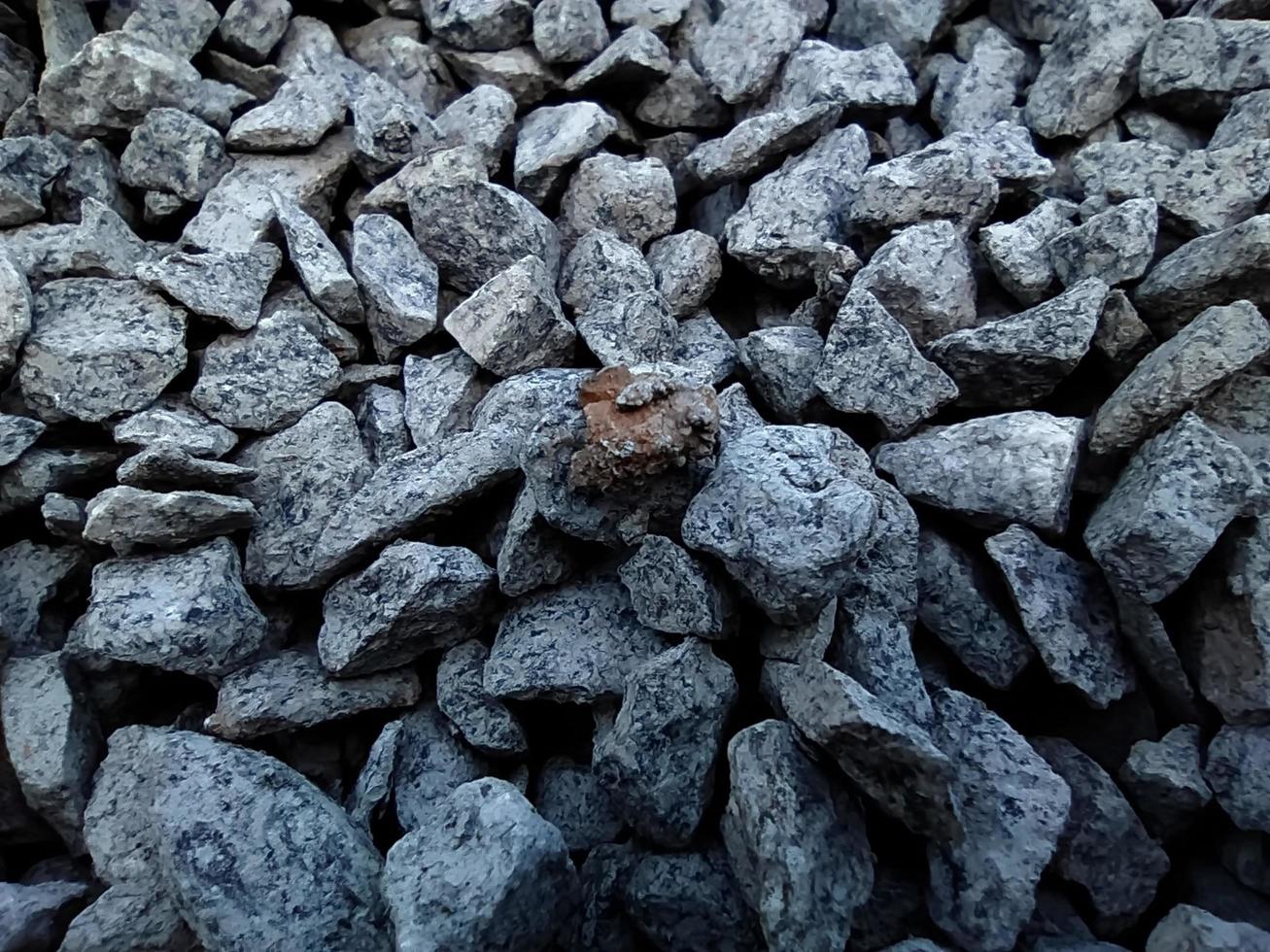 Background of gray patterned texture of crushed stone. photo