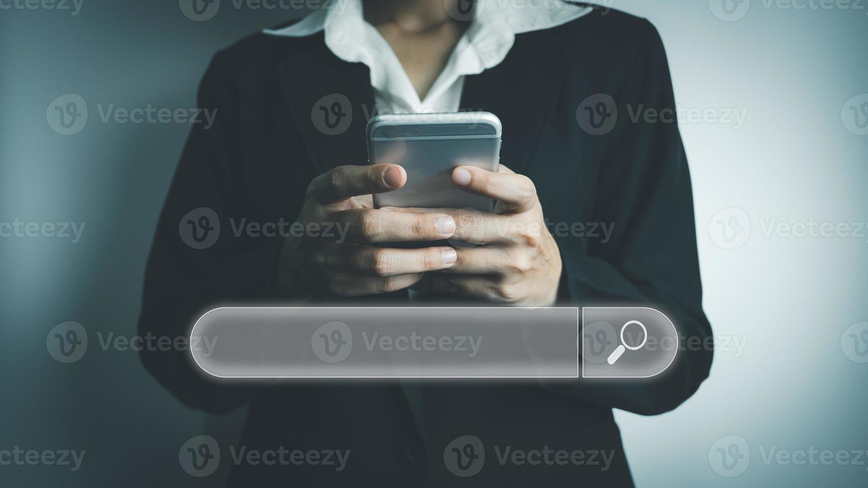 Search Engine optimization SEO concept, Businesswoman is using smartphone to search for information on Internet, Using the search bar, Wireless Network, big data and accessing website information. photo