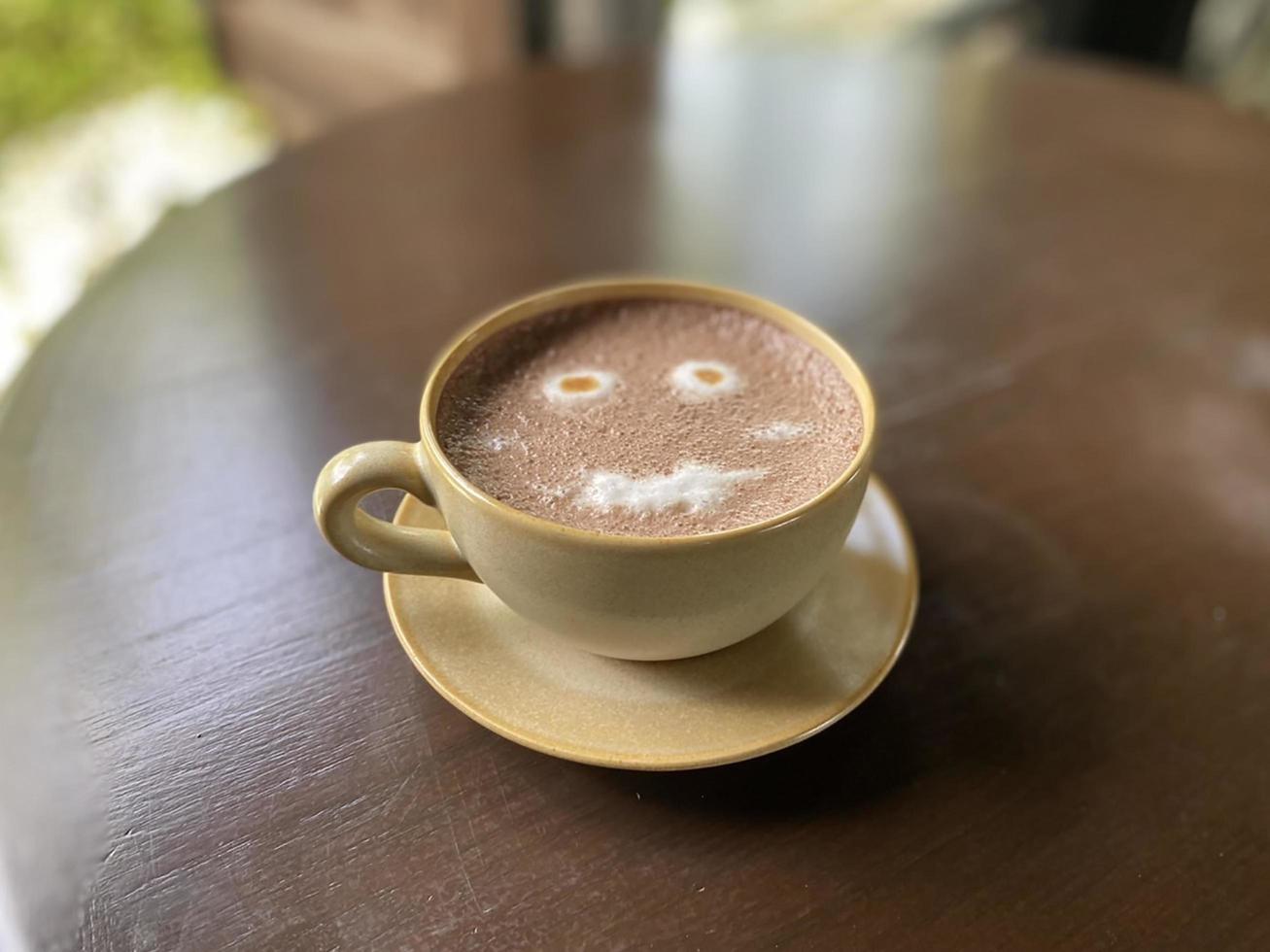 Hot coffee cup on table photo