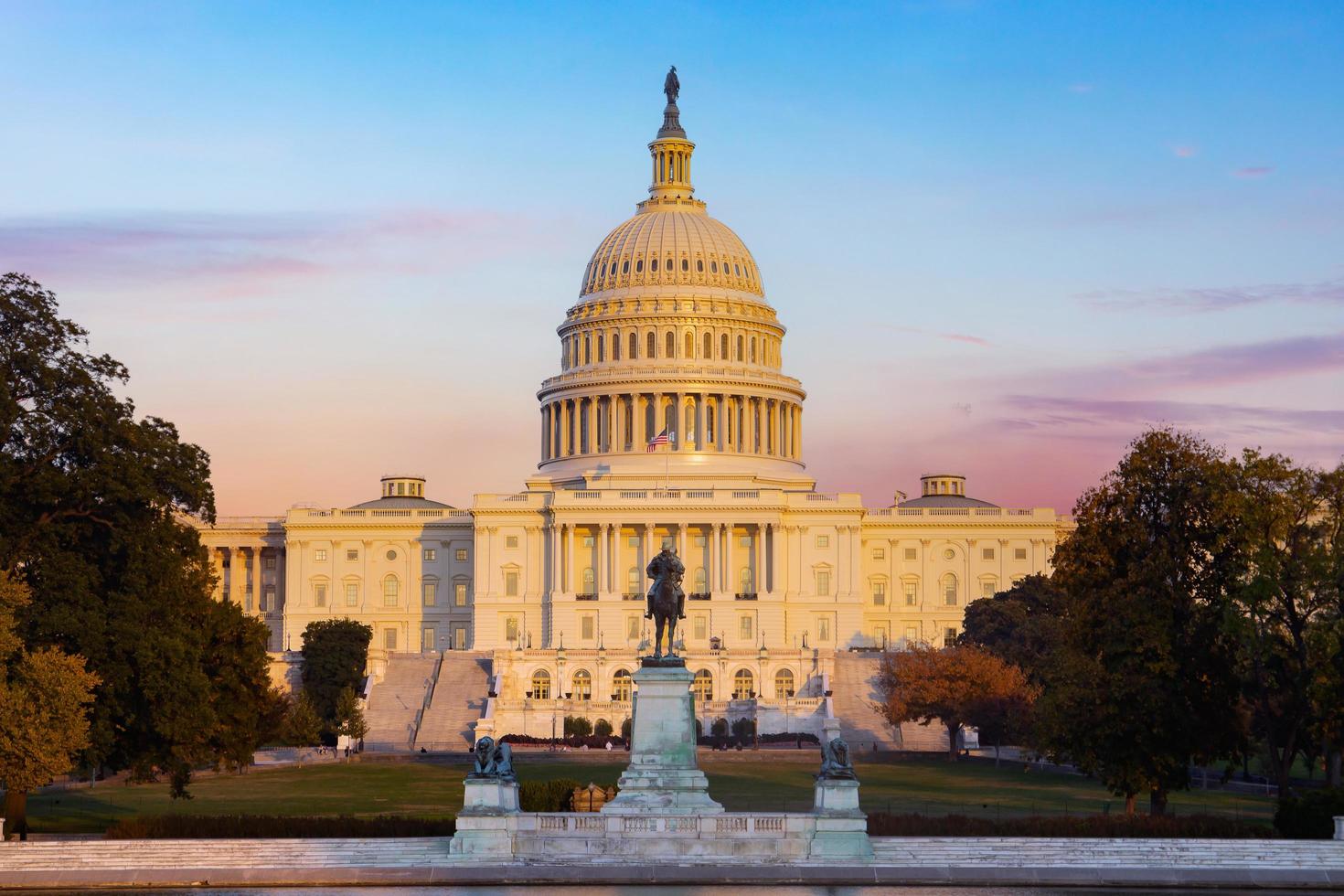 The United States Capitol building at Washington D.C. in the evening. photo