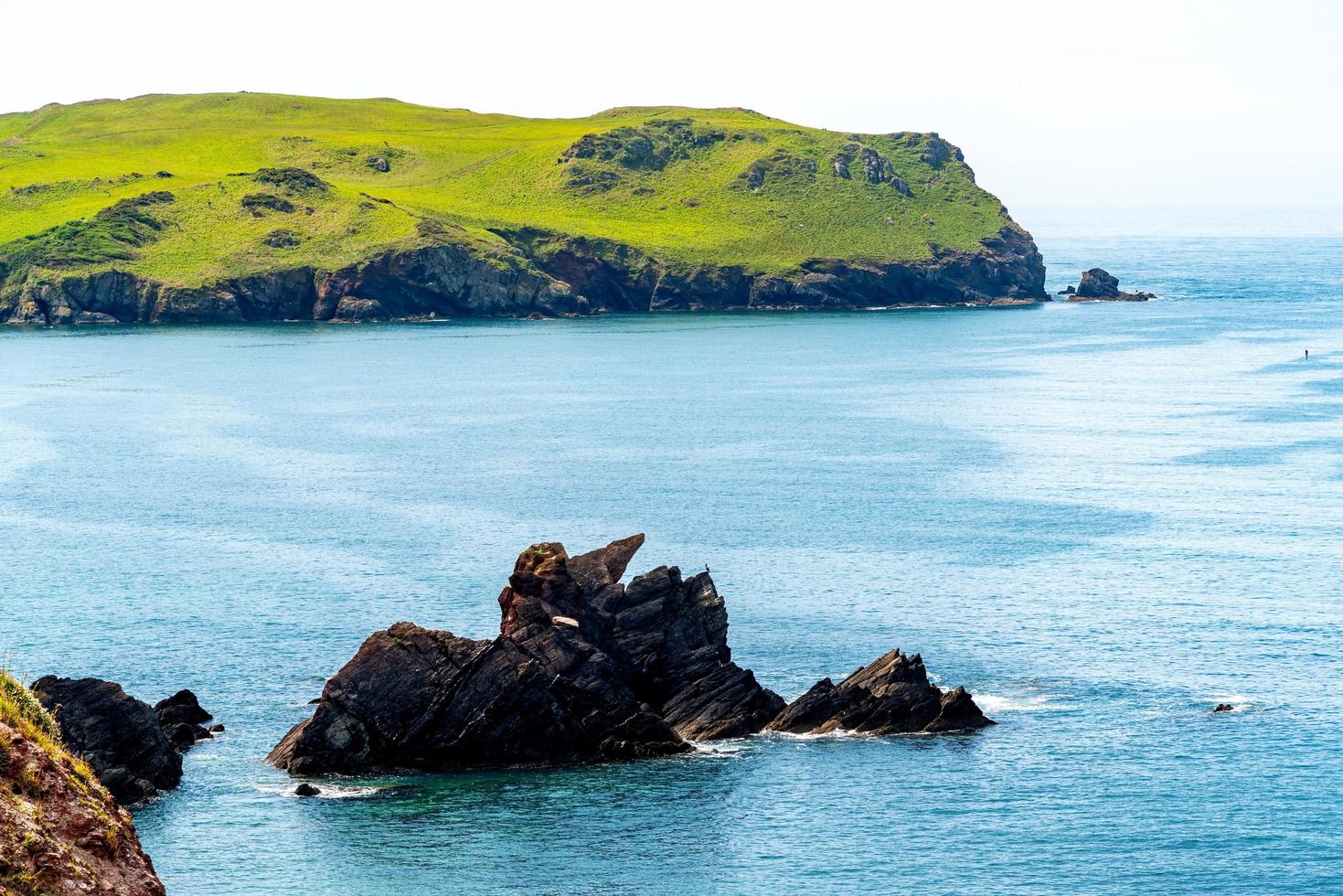 Rocks in the sea near Outer Hope in Devon photo