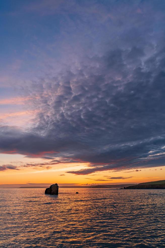 Sunset at Thurlestone Rock, South Milton Sands in Devon photo