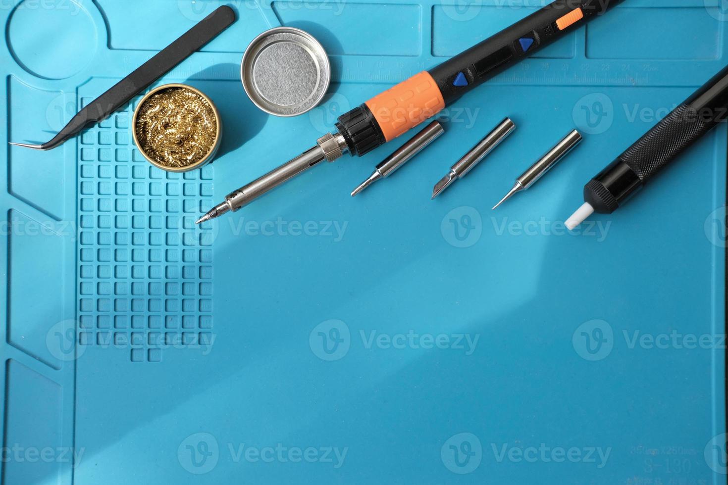 portable electric soldering iron and computer curcuits. photo