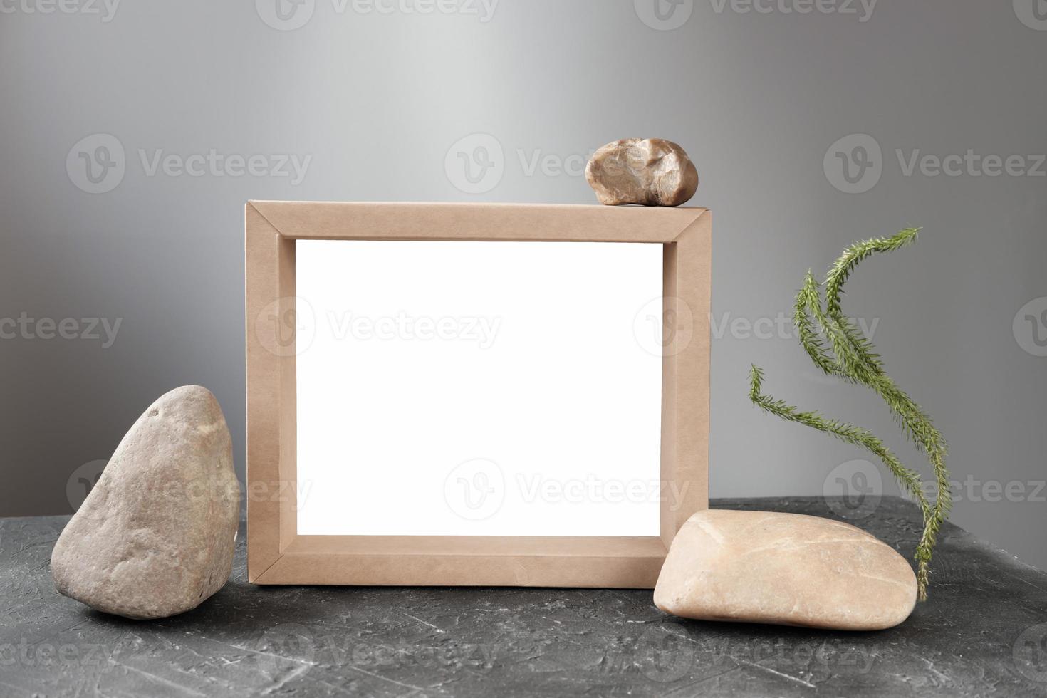 natural stones and wooden or cardboard frame photo