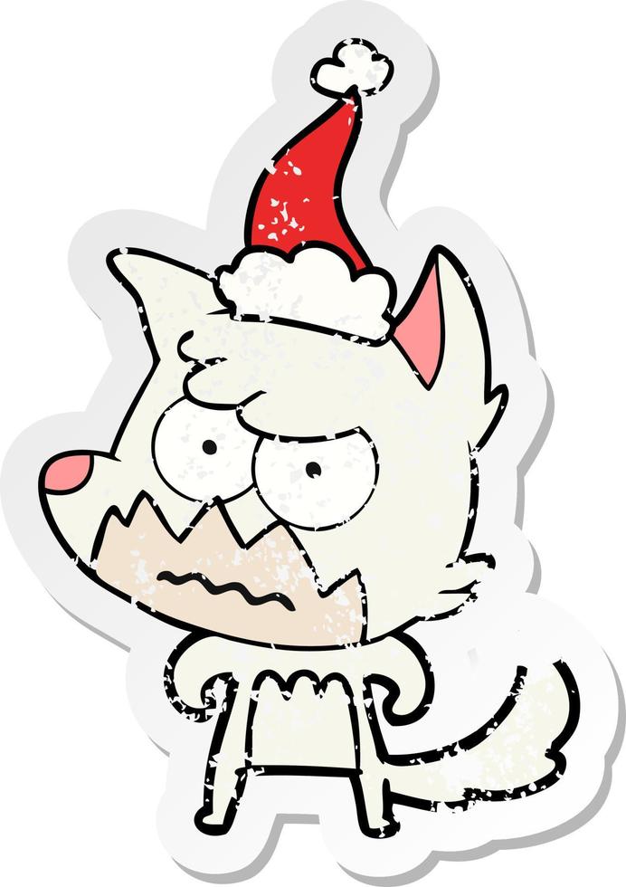 distressed sticker cartoon of a annoyed fox wearing santa hat vector