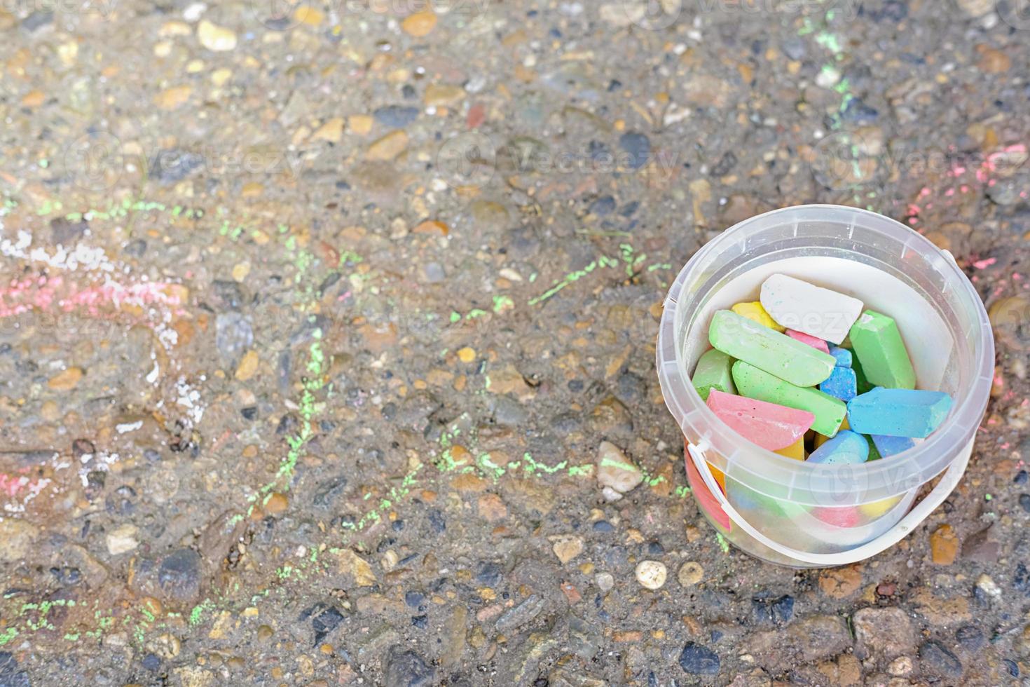 colored crayons or color chalk for outdoors drawing. photo