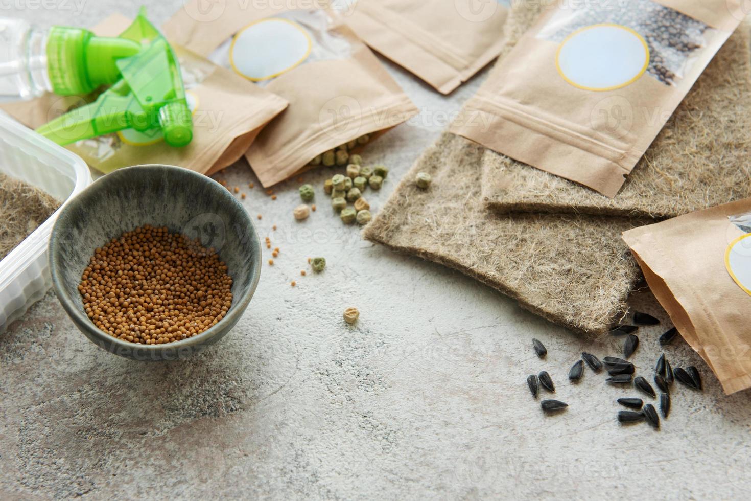Microgreen seeds in paper bags and equipment for sowing microgreens. photo