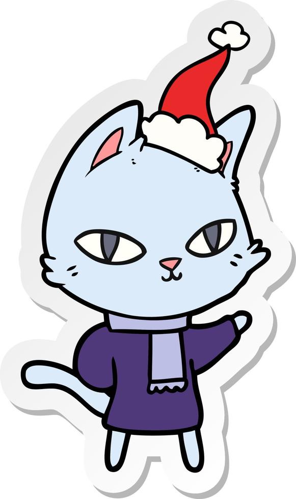 sticker cartoon of a cat staring wearing santa hat vector