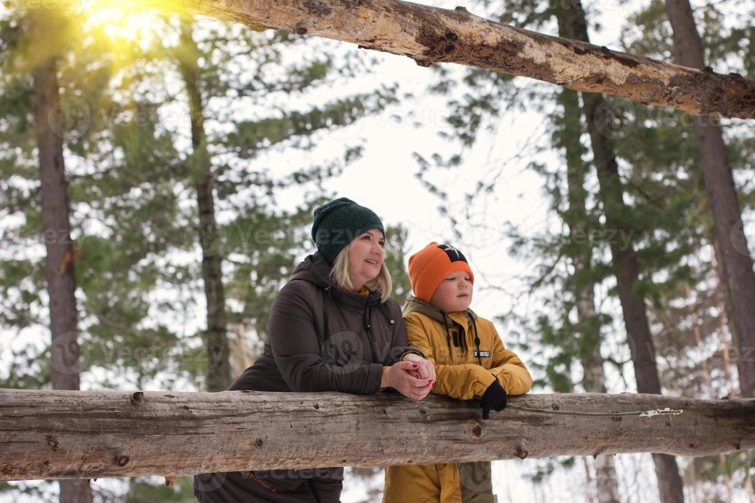 mother and son relaxing in the forest. photo