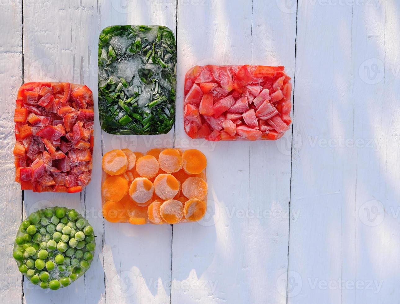 Frozen vegetables in geometric shapes. top view. photo