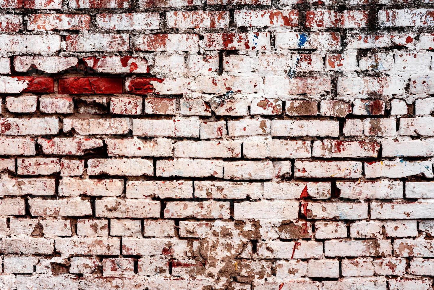 textura desgastada del viejo fondo de pared de ladrillo blanco y naranja oscuro teñido foto