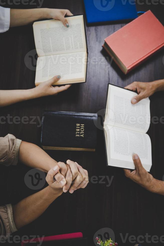 Group of people praying worship believe photo