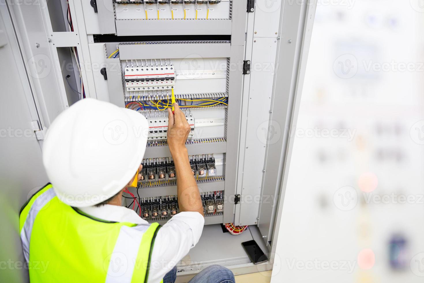 Electrical Engineer team working front control panel, Engineer training job with control panel in service room. photo