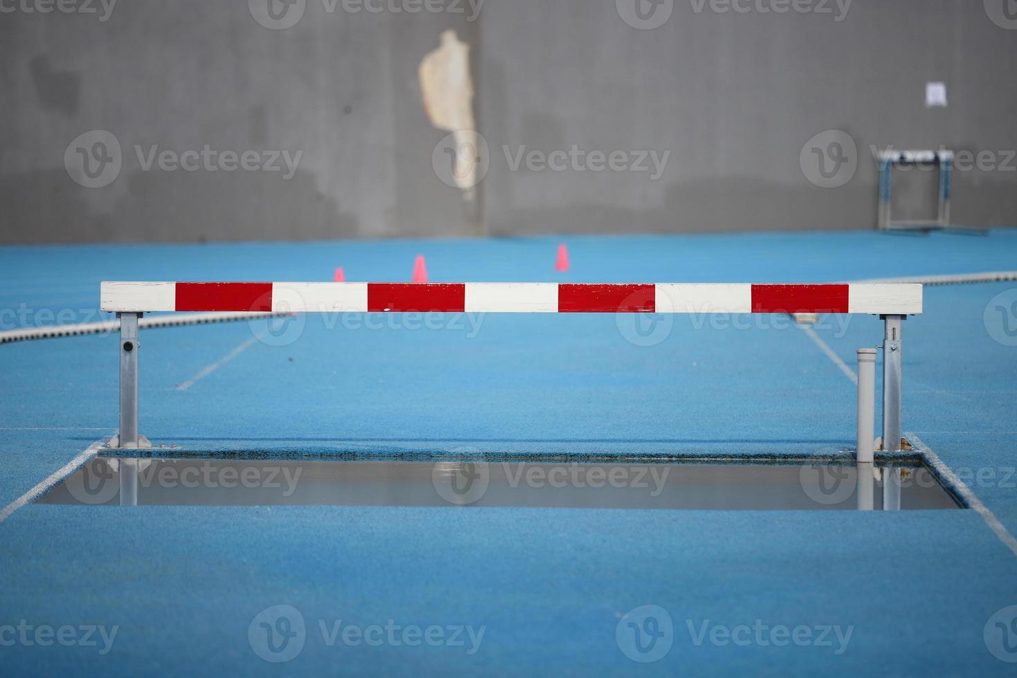 Obstacle and water in track and field photo