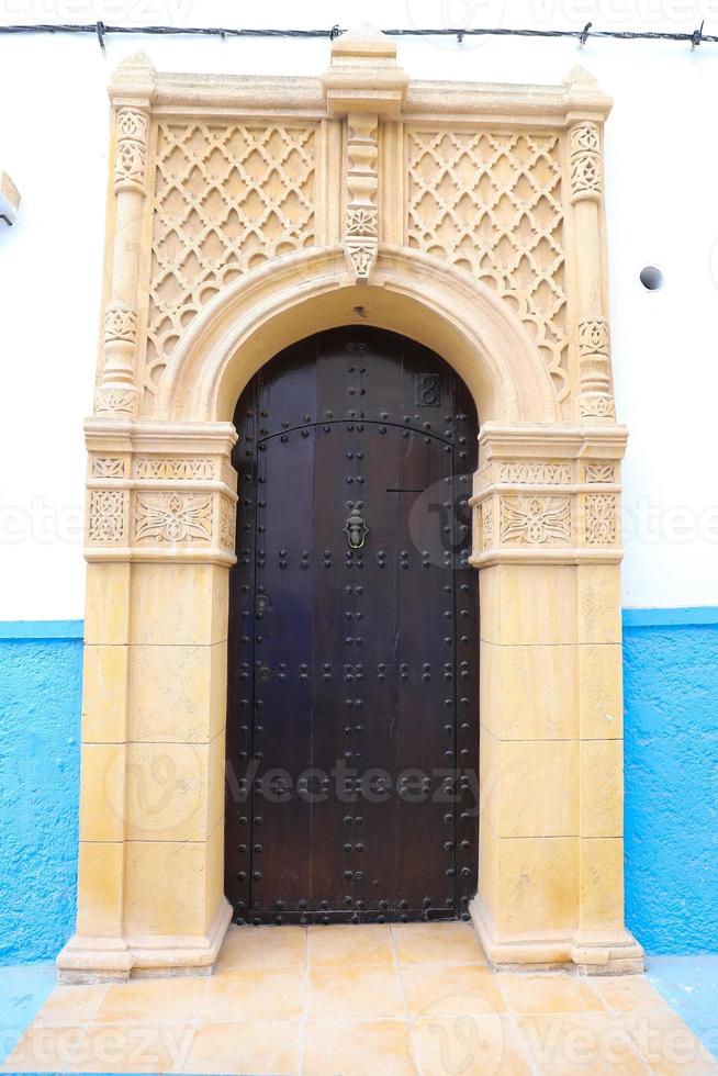 Door of a building in Kasbah of the Udayas in Rabat, Morocco photo