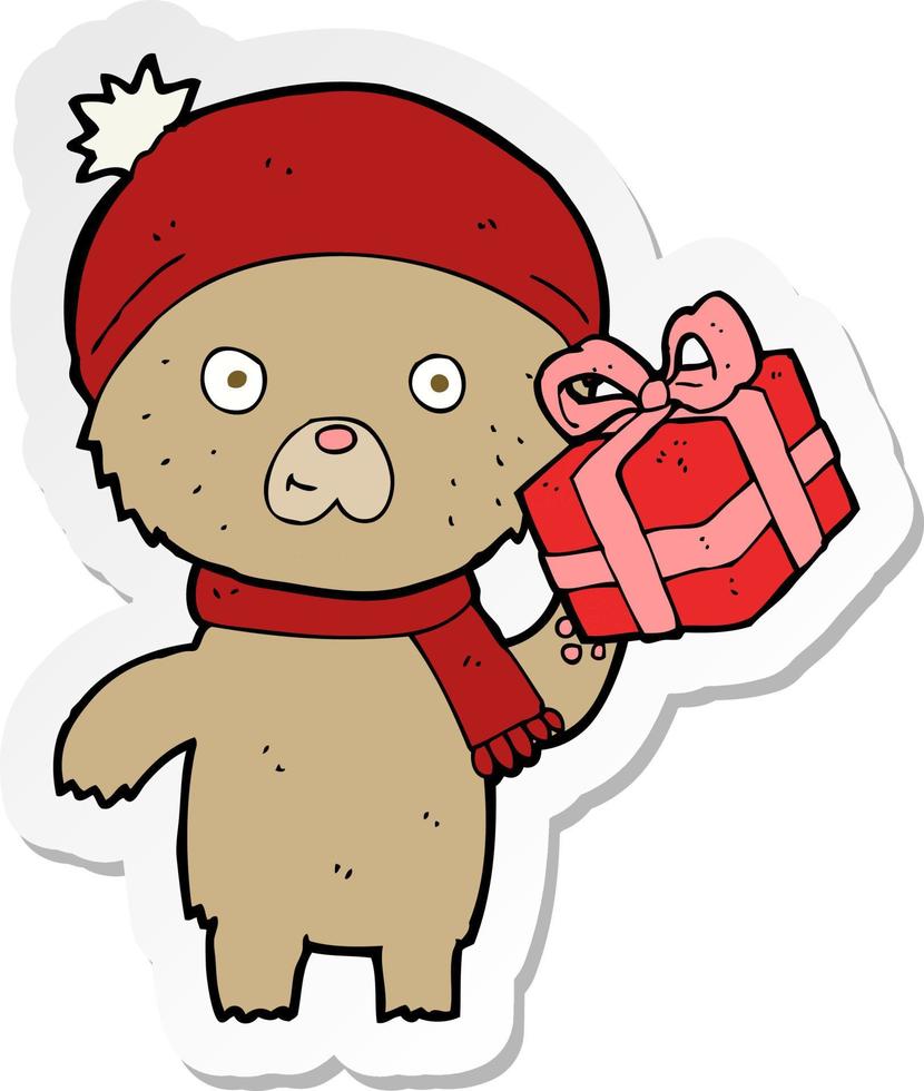 sticker of a cartoon christmas teddy bear with present vector