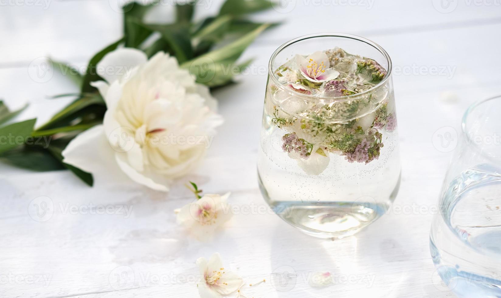 a glass with floral infused drink photo