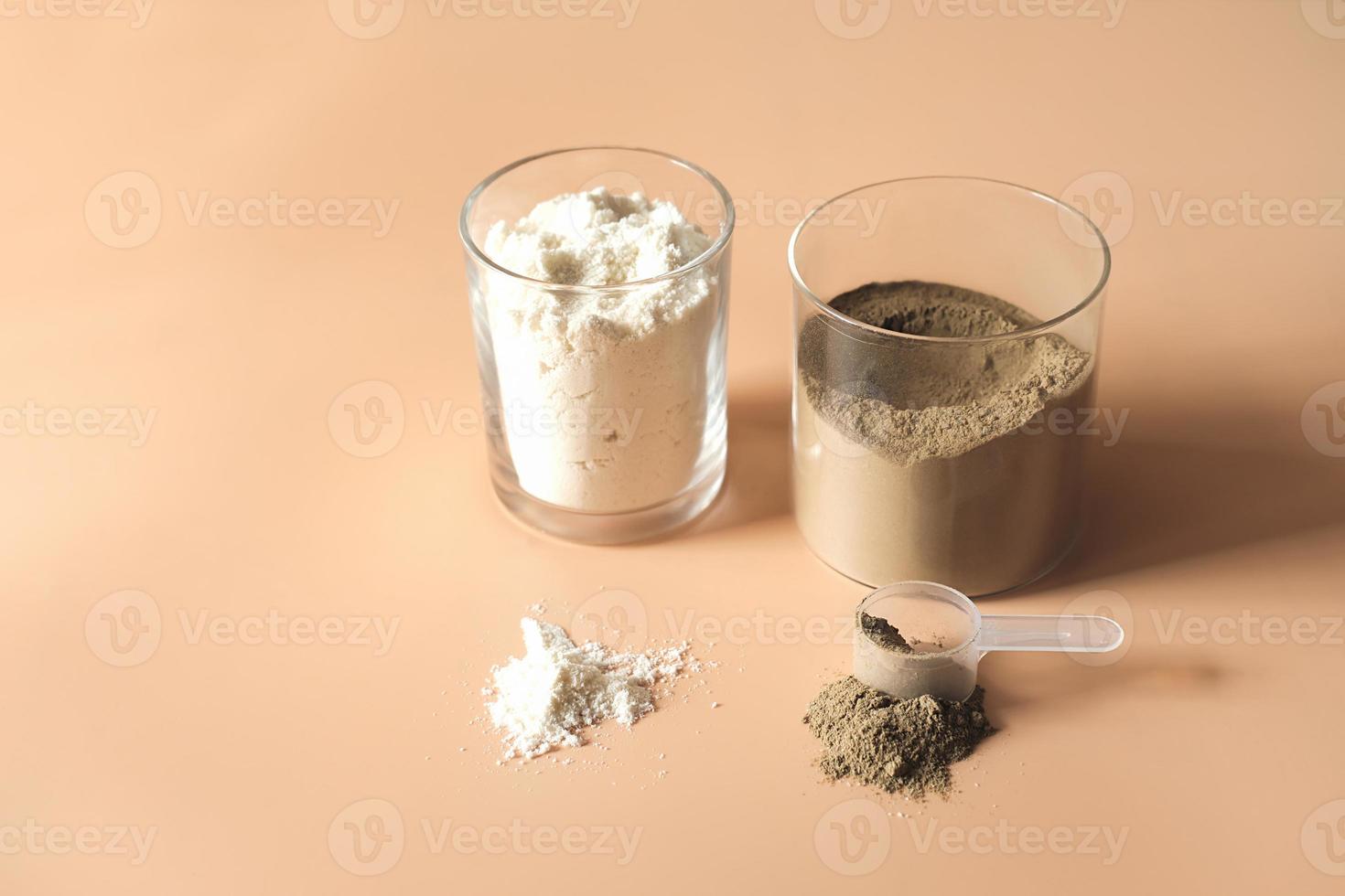 jars of whey protein powder with chocolate and vanilla flavour. scoop of protein on a table. healthy nutrition for beauty and joints. athletic supplement photo