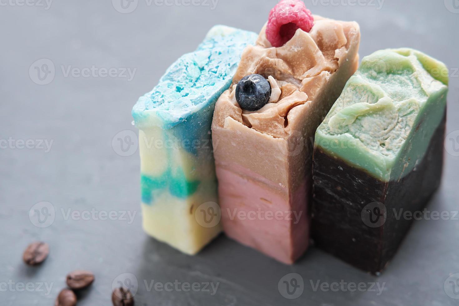 three bars of hand made organic soap for spa relax routine. exfoliating soap with various components for smoth and healthy body skin photo