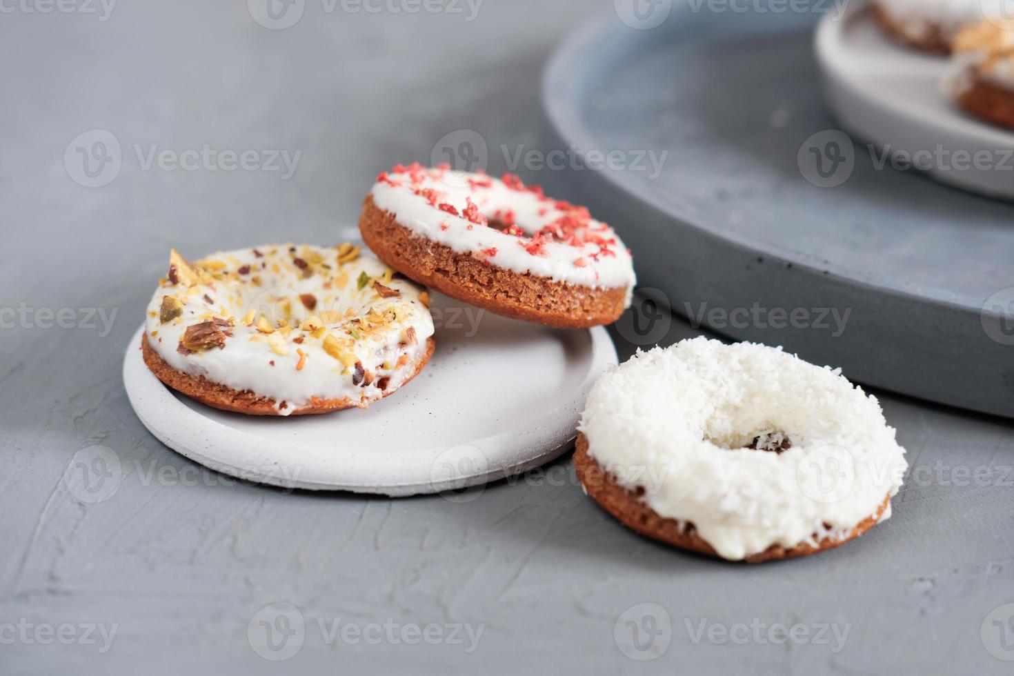 keto donuts with glaze and sprinkles of sublimated strawberry. low carb