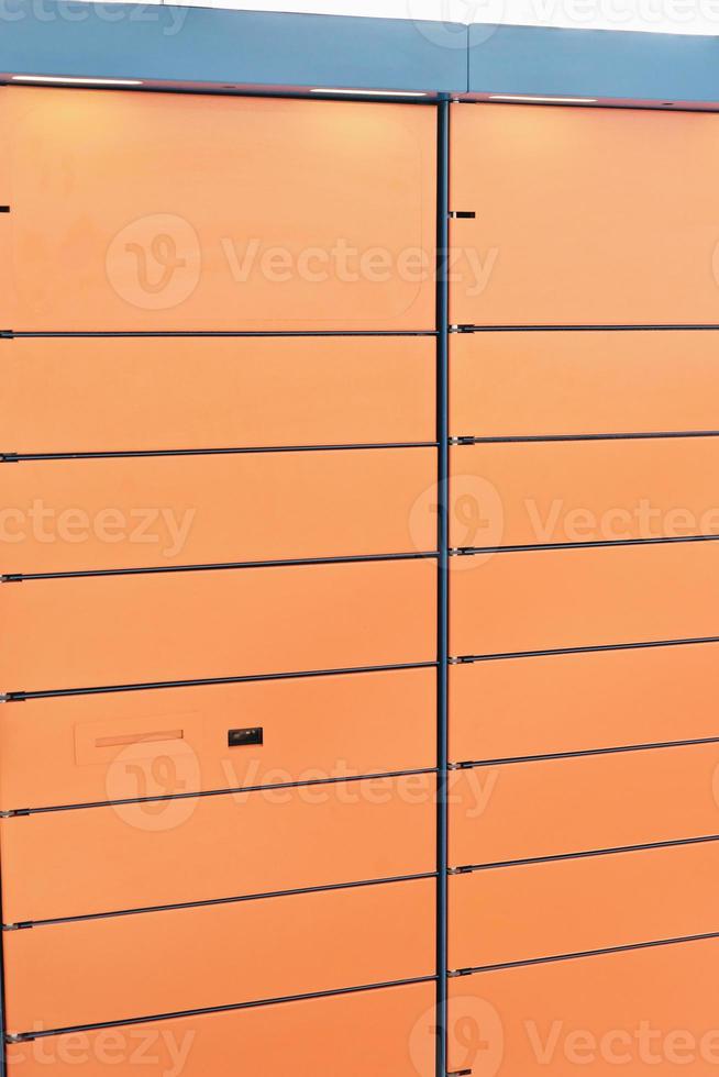 automated self service post terminal machine or locker to receive a parcel or to deposit the box. contactless delivery pick up point, vertical size. photo