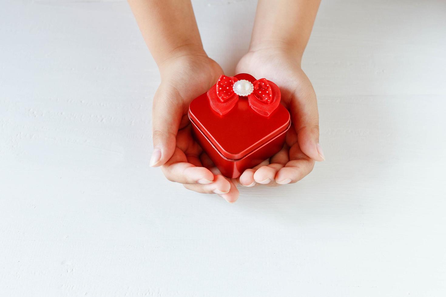 Red gift box in hand photo