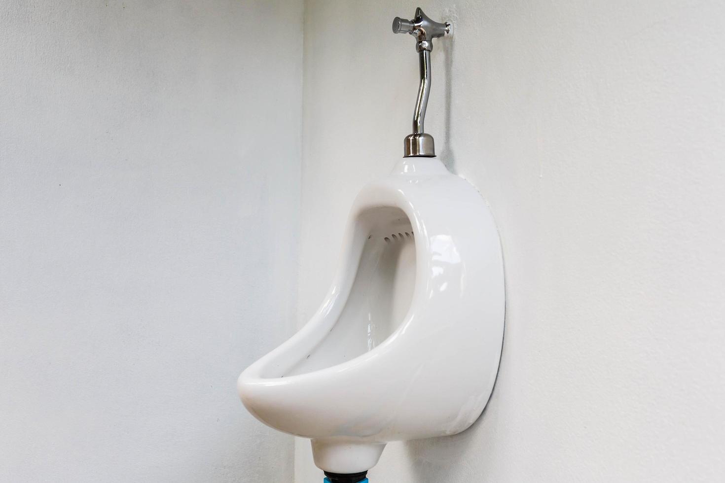 White Urinal in Men's Toilet photo