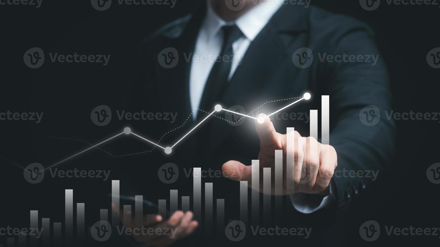 Businessman touching virtual screen and data statistical index graph, stock market data and stock exchange concept, stock market financial analysis graph. photo