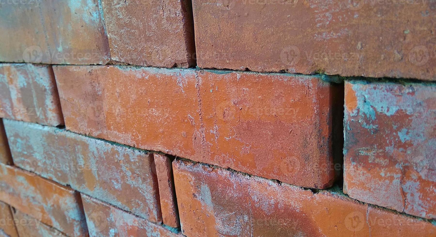 Red orange brick tile wall background. Architecture and building background design. photo