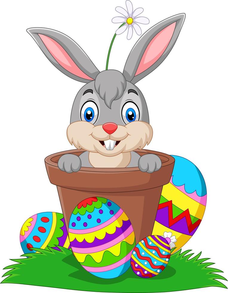 Cartoon bunny in the pot with easter eggs on the grass vector