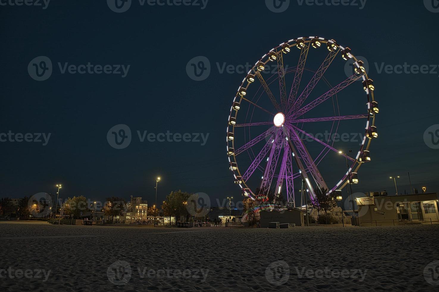 A merry-go-round at the beach amusement park at night photo