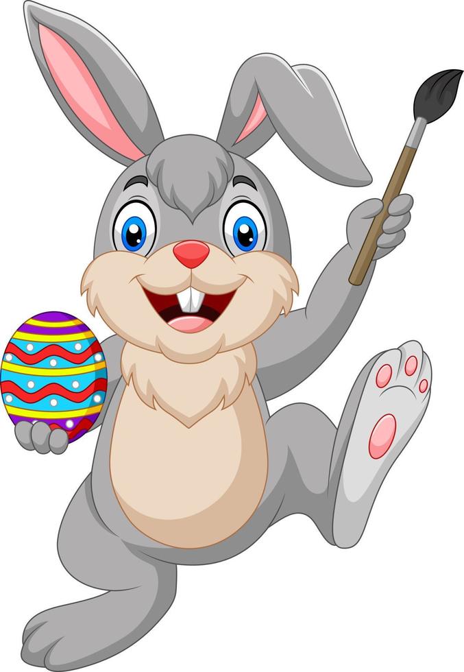 Cartoon rabbit painting an Easter egg vector