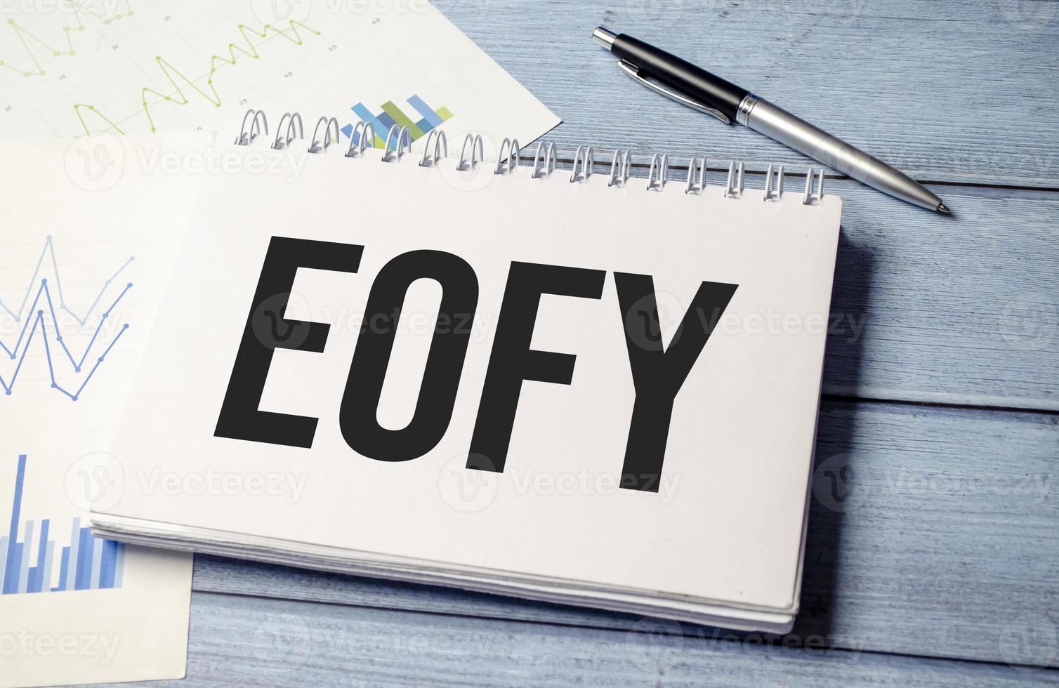 pen and a sheet of white paper with the text End of Financial Year photo