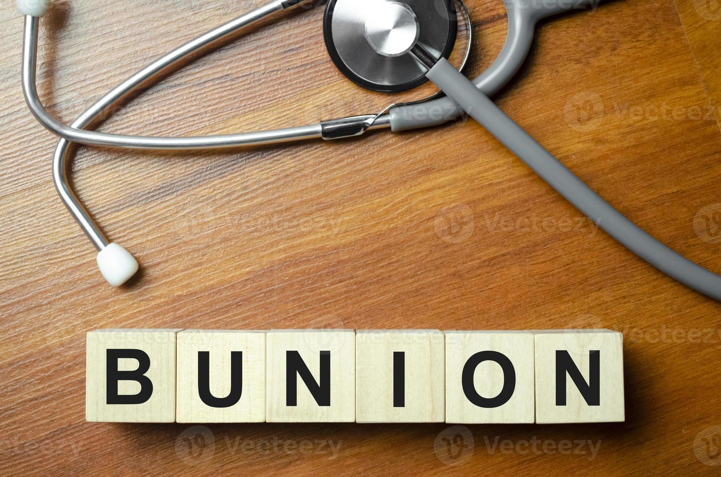 BUNION word written on building blocks concept photo