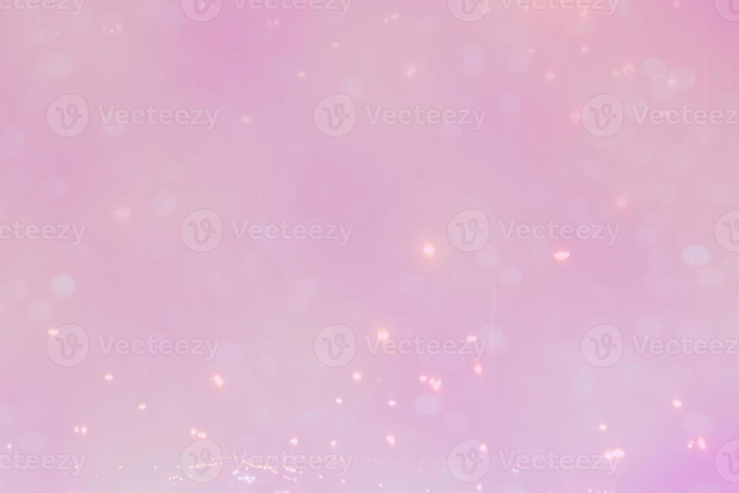 Abstract light bokeh on the pink background photo
