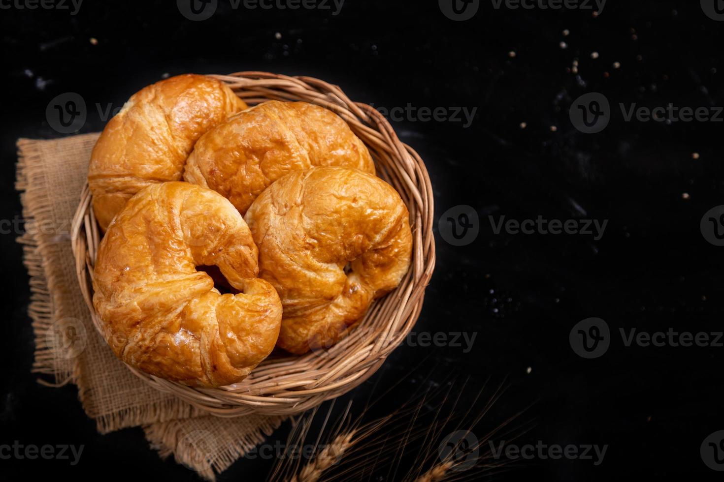 Top view Croissant in the Wicker basket photo