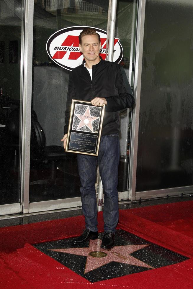 LOS ANGELES, MAR 21 - Bryan Adams Bryan Adams is honored with a star on the Hollywood Walk of Fame at Hollywood Walk of Fame on March 21, 2011 in Los Angeles, CA photo