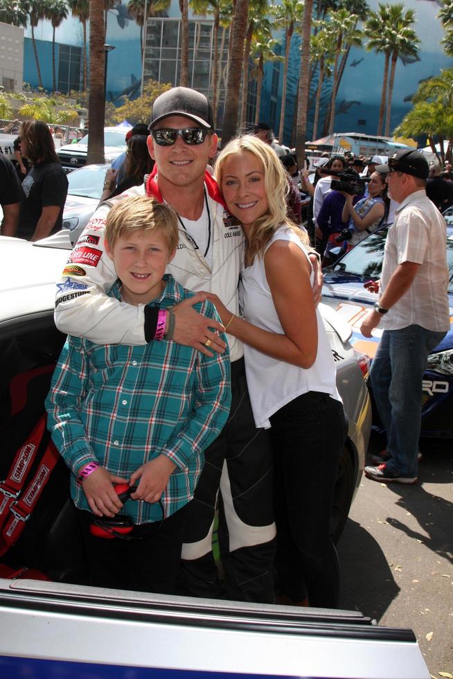 LOS ANGELES, APR 12 - Cole Hauser, son, Cynthia Daniel at the Long Beach Grand Prix Pro Celeb Race Day at the Long Beach Grand Prix Race Circuit on April 12, 2014 in Long Beach, CA photo